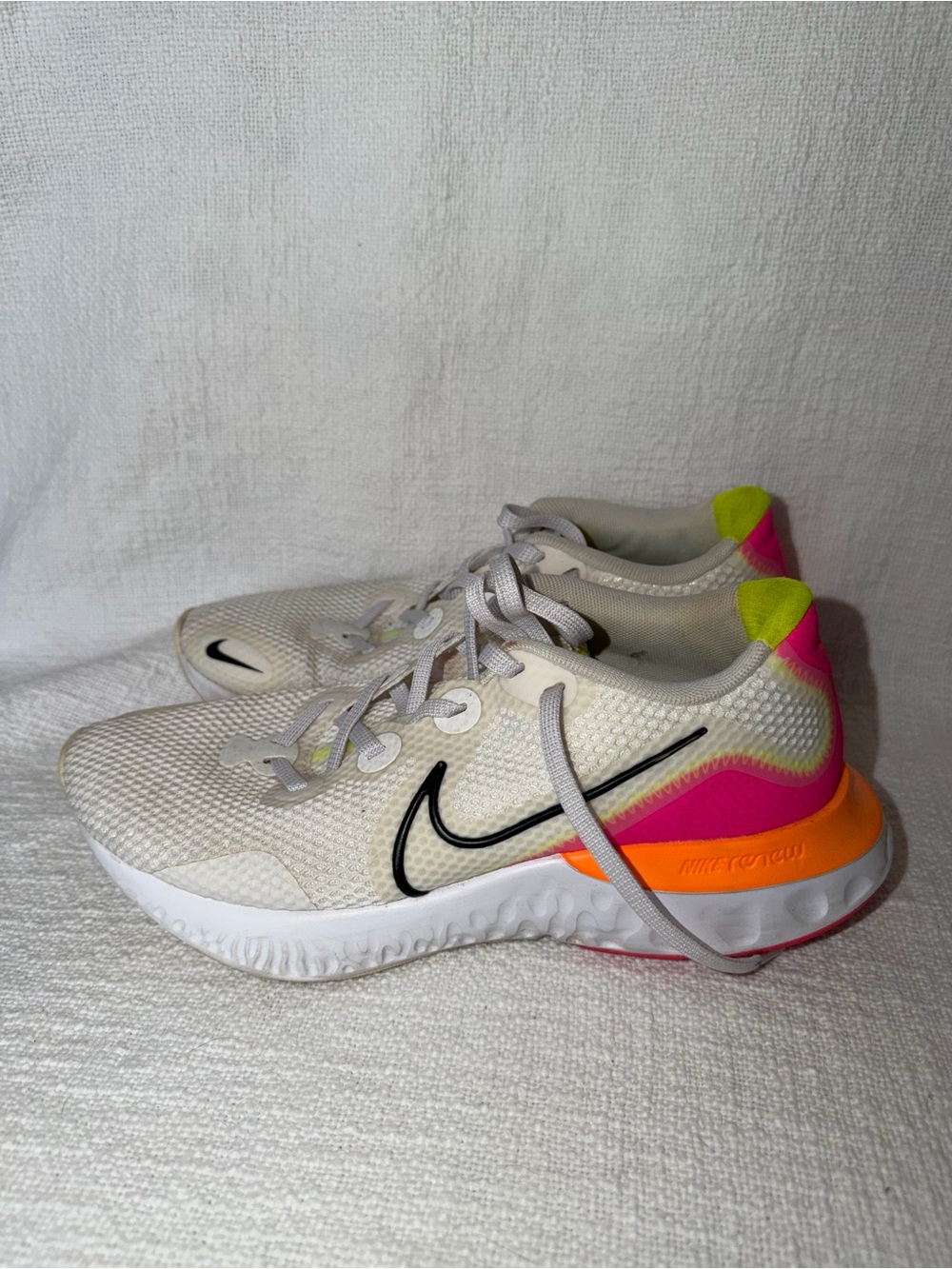 Nike White Running Sneakers with Pink, Orange, and Neon Yellow Accents